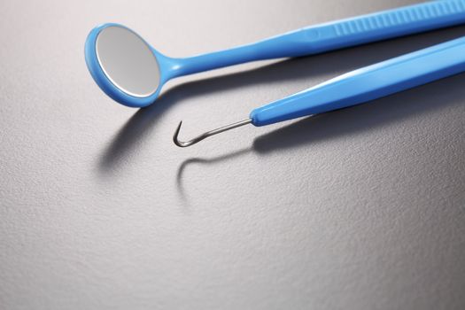 Basic dentist tools isolated on gray