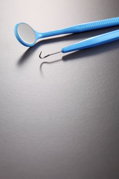 Basic dentist tools isolated on gray