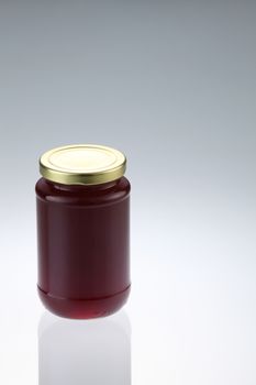 cranberry fruit jam in the glass container