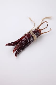 bunch of the dried chilli on the white background