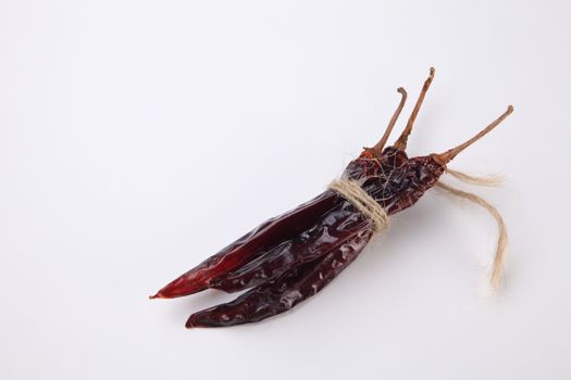 bunch of the dried chilli on the white background