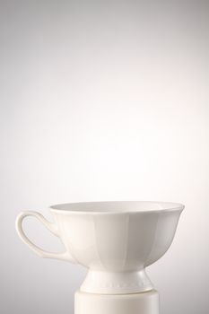 plain antique tea cup isolated on a white background 