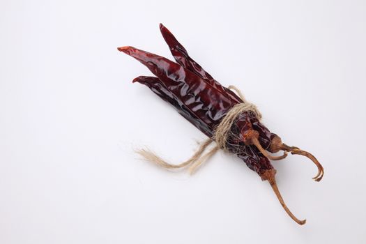 bunch of the dried chilli on the white background