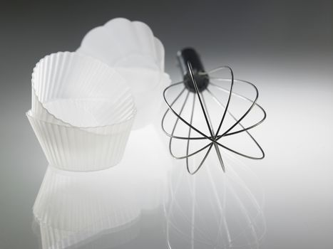 whisk and the silicone muffin holder