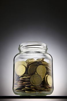 money or coins in the saving jar