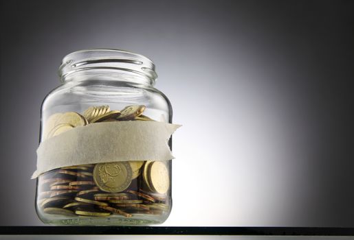 Jar of coins with label for your own text