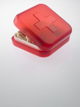 red pill box with medicine