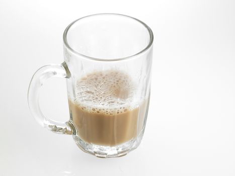 Half glass of Tea with milk or Teh Tarik in Malaysia
