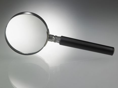 Magnifying glass on top of glass table