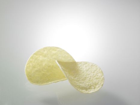 Potato chips on top of glass table