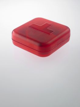 red pill box with medicine