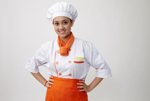 Portrait of a Indian woman with chef uniform with confident