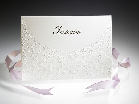 invitation card with pink ribbon