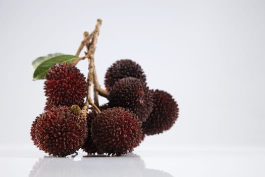 pulasan  thick skin or wild rambutan on the white background