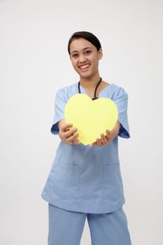 Close up of the nurse holding heart shape
