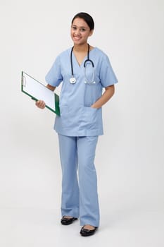 nurse doctor woman smile with stethoscope hold clipboard, wear blue surgery medical suit. Isolated over white background

