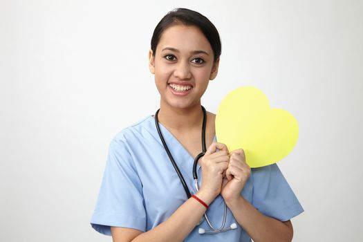 Close up of the nurse holding heart shape