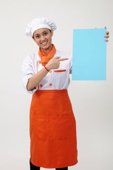 Indian woman with chef uniform holding a blank card