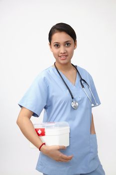 female nurse or doctor carrying a portable first aid kit isolated on white