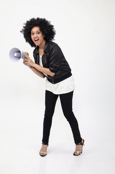 Indian teenage holding a megaphone on the white background