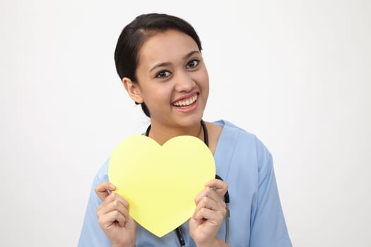 Close up of the nurse holding heart shape