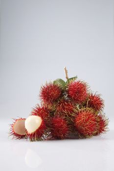 asian fruit rambutan on the plain background