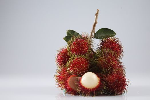 asian fruit rambutan on the plain background