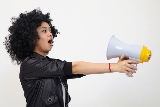 Indian teenage holding a megaphone on the white background