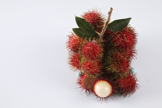 asian fruit rambutan on the plain background