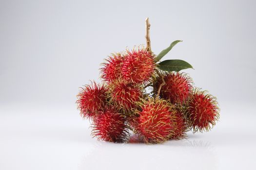 asian fruit rambutan on the plain background