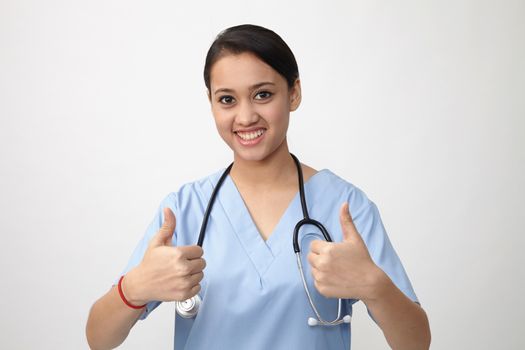 Young Indian medic showing thumbs up