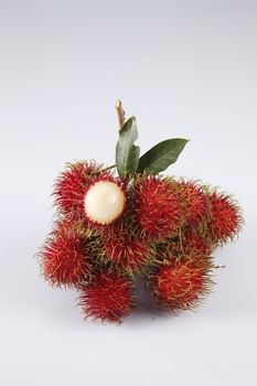 asian fruit rambutan on the plain background