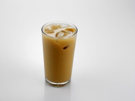 Ice coffee in a glass over gray background