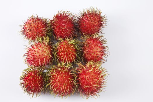 asian fruit rambutan on the plain background