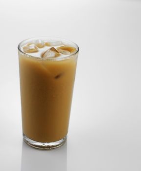 Ice coffee in a glass over gray background