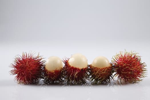 asian fruit rambutan on the plain background