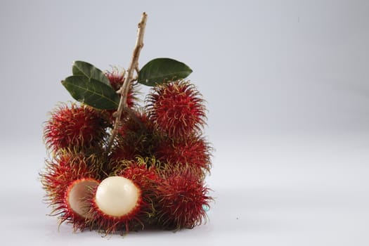 asian fruit rambutan on the plain background