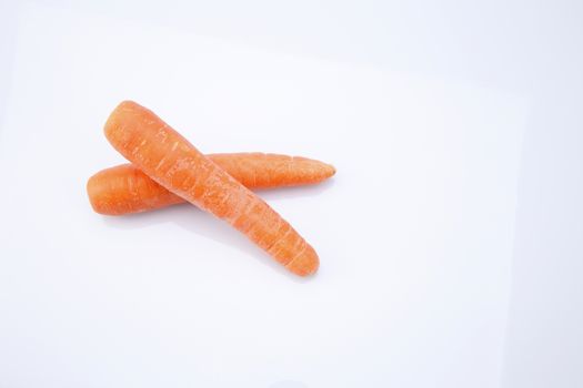 top view of fresh carrot on the white background