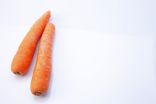 top view of fresh carrot on the white background