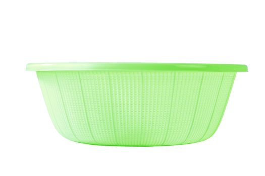 green plastic basket on a white background