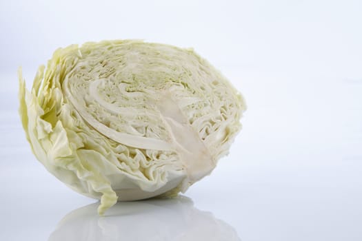 Cabbage cut in half isolated on white background