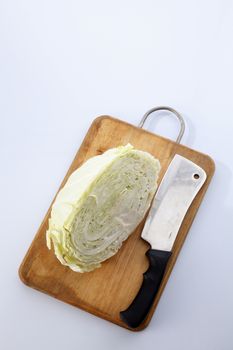 Cabbage cut in half isolated on white background