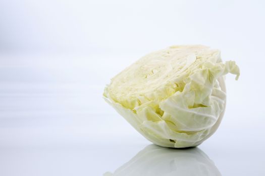 Cabbage cut in half isolated on white background