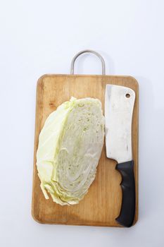 Cabbage cut in half isolated on white background