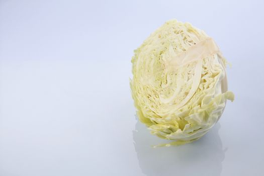 Cabbage cut in half isolated on white background