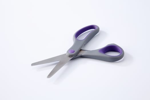 pair of scissors on the white background