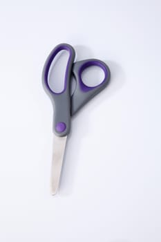 pair of scissors on the white background