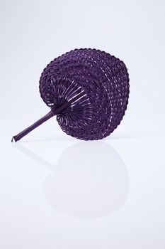 native fan made from palm leaves on white background