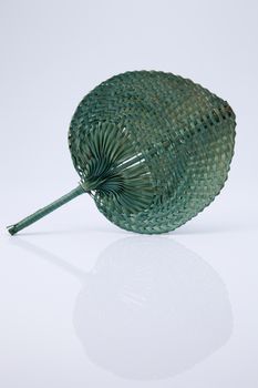 native fan made from palm leaves on white background