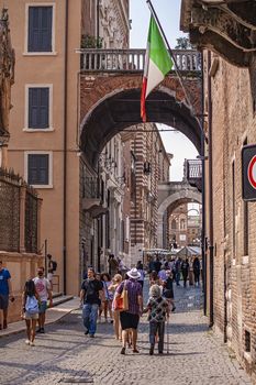 VERONA, ITALY 10 SEPTEMBER 2020: Arcades in Verona full of people walking
